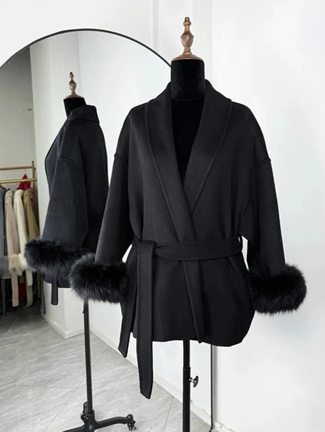PLUSH COAT WITH LAPEL AND BELT.