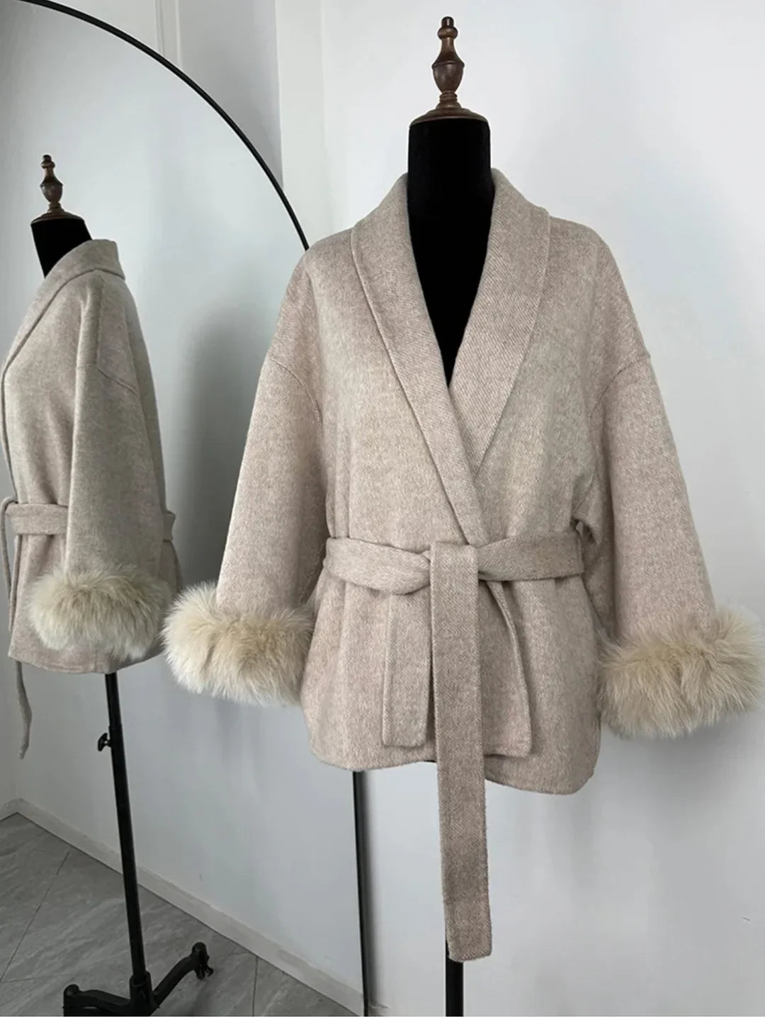 PLUSH COAT WITH LAPEL AND BELT.